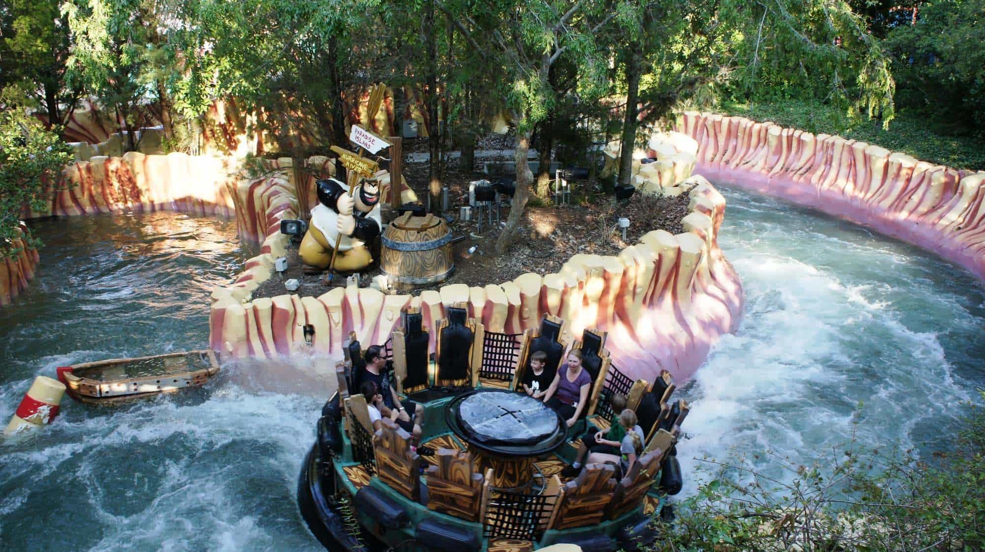 An eight-person raft navigates the rapids of Popeye and Bluto's Bilge-Rat Barges.